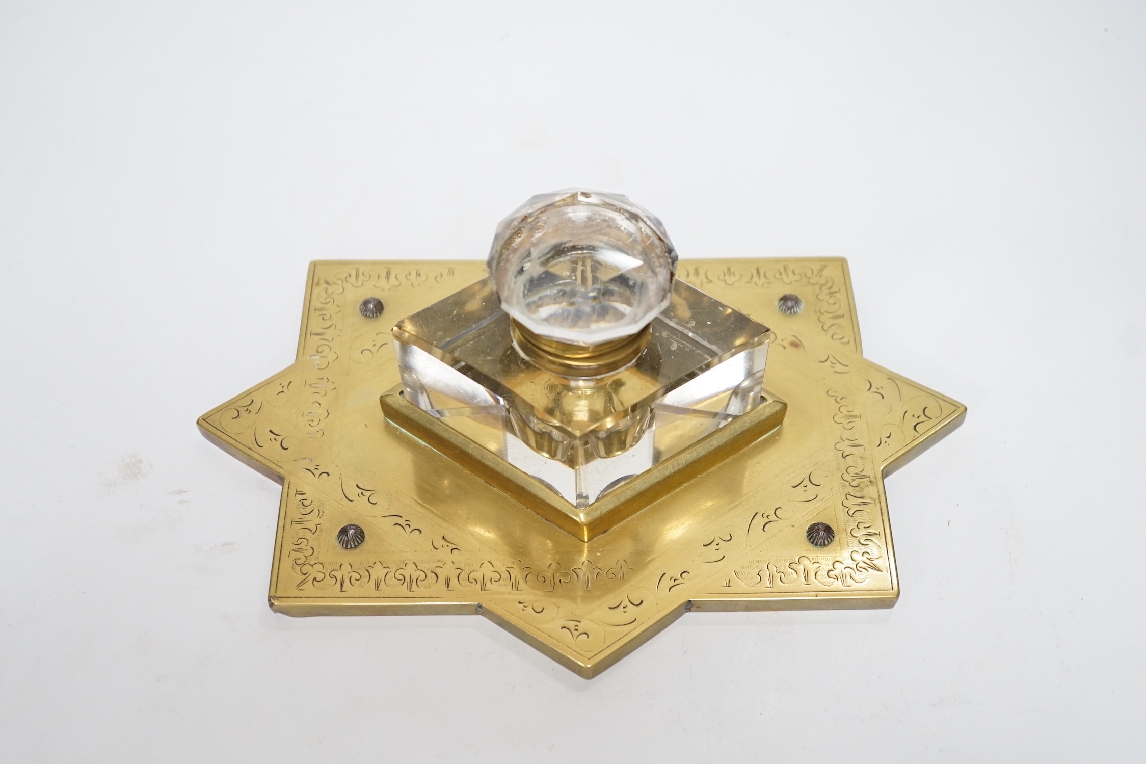 A Victorian brass mounted glass inkwell. 24cm wide